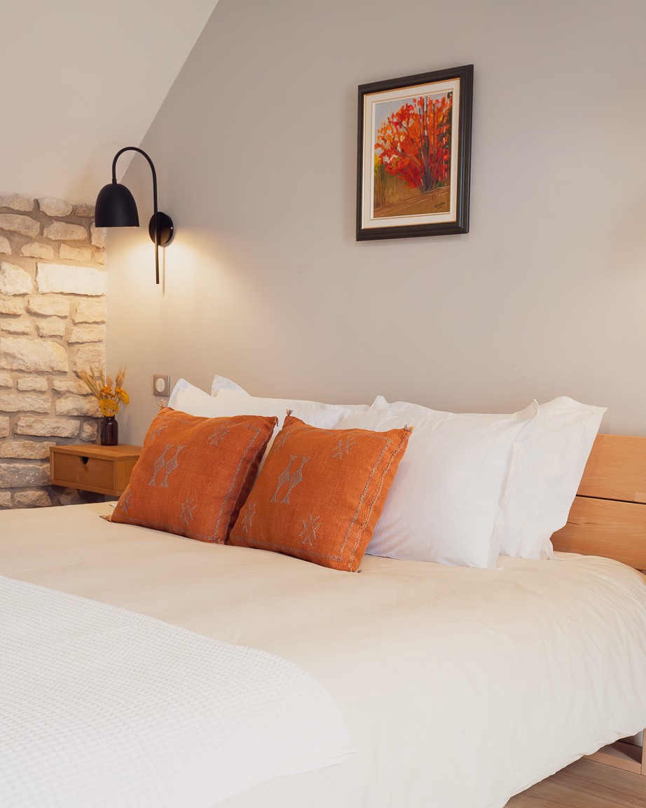 Restored bedroom detail at Maisons Vaudésir