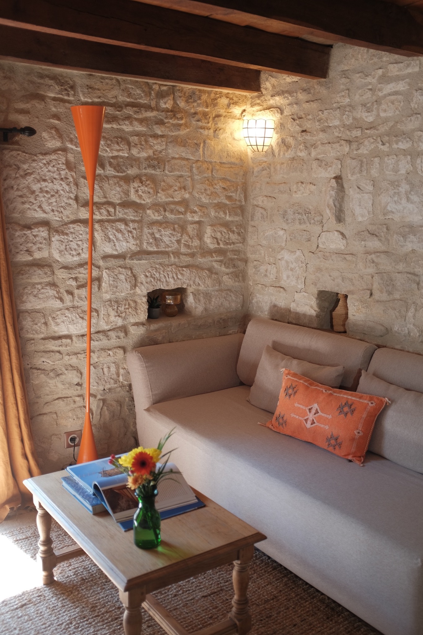 Linen sofa and orange floor lamp in the upstairs sitting corner