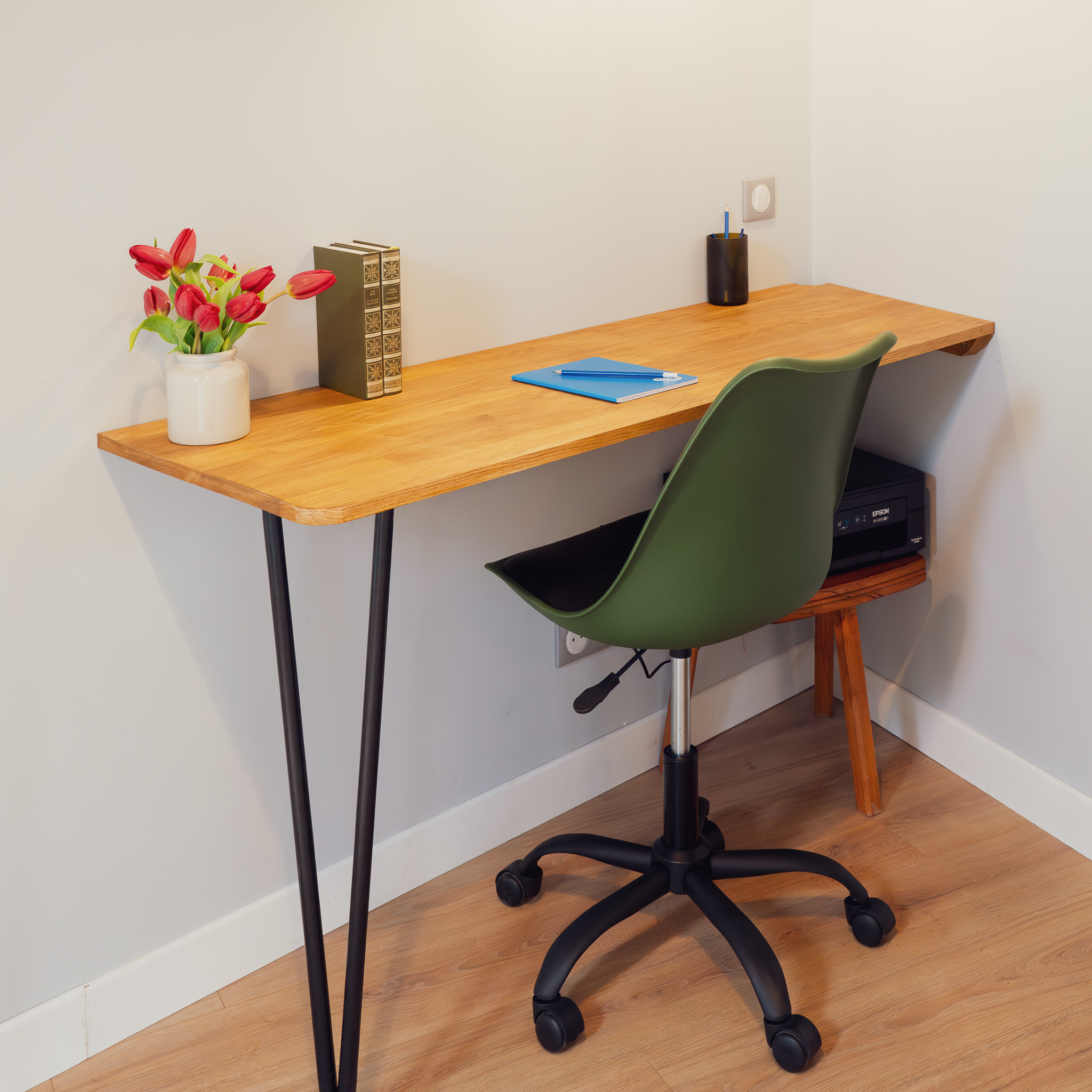 Desk with tulips and green office chair